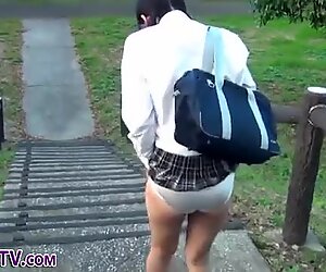 Asian teen toy in public